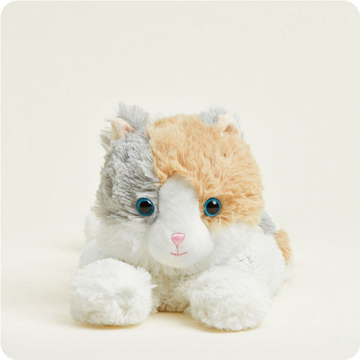 Warmies plush calico cat with white, orange and gray fur and blue eyes