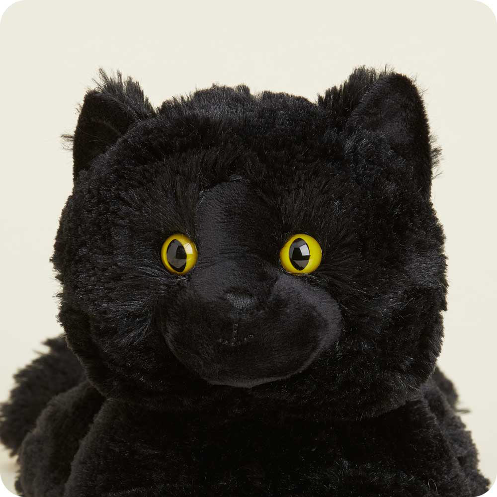 Warmies black cat plush toy with bright yellow eyes and soft fur