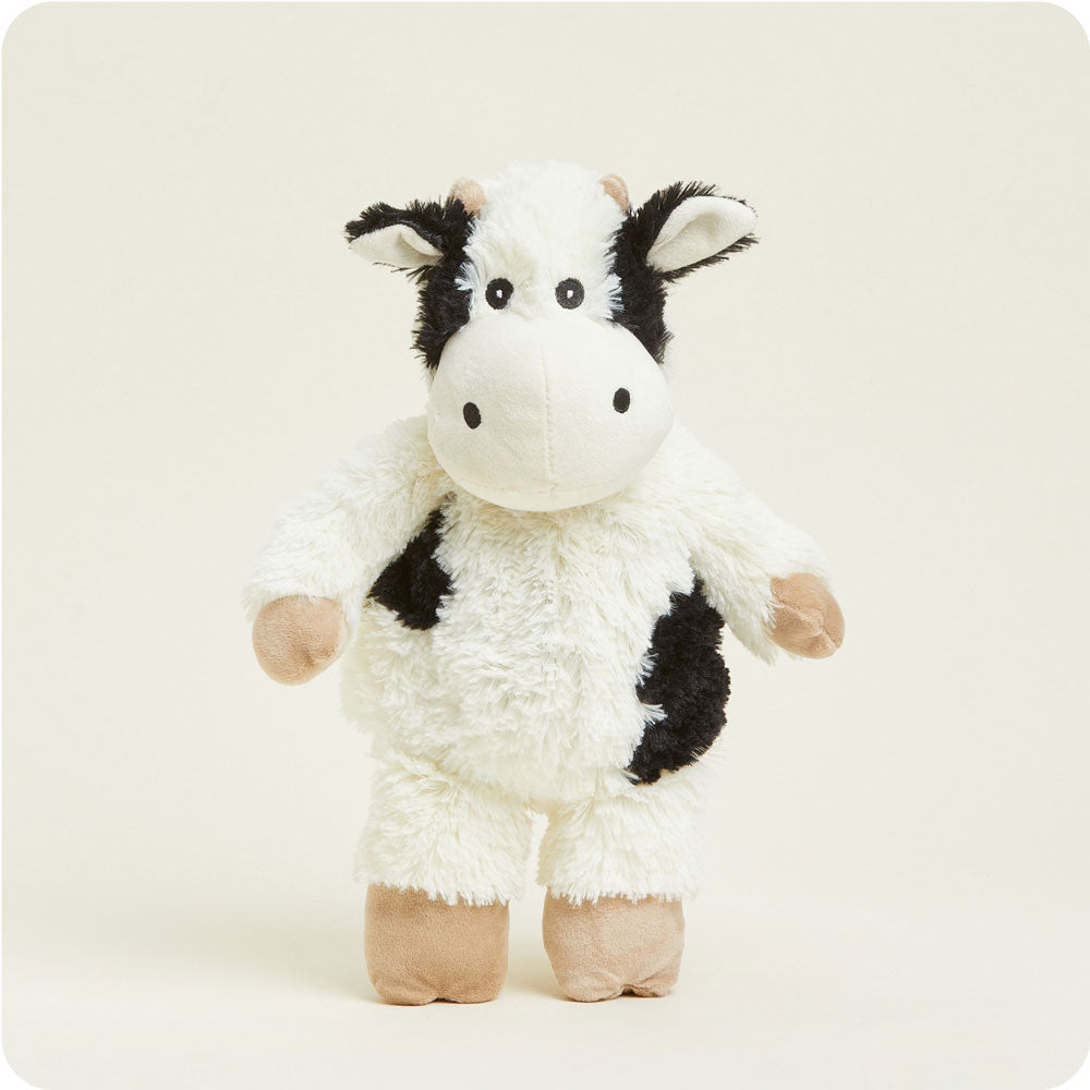 Warmies plush cow stuffed animal with white fur and black spots