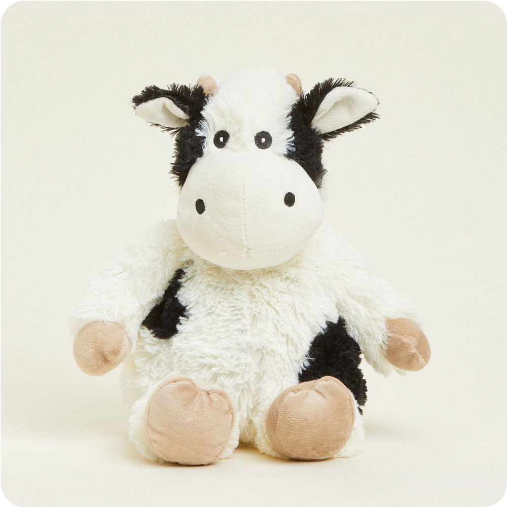 Warmies plush cow stuffed animal with black and white spots and pink hooves