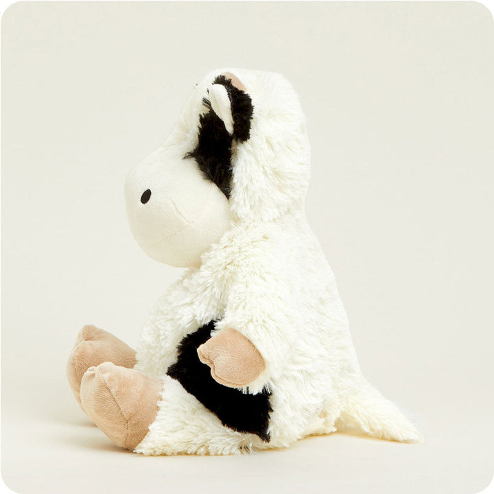 Warmies plush cow stuffed animal with black and white spotted pattern and tan hooves