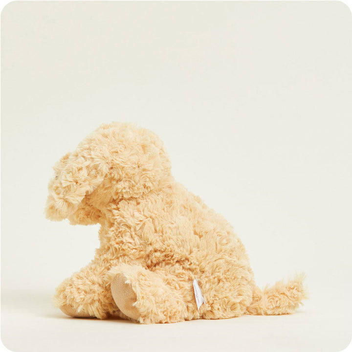 Warmies golden plush dog stuffed animal sitting against clean white background