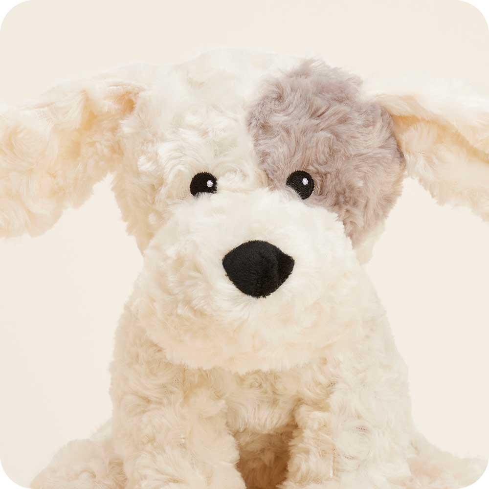 Warmies Patch Curly Dog plush toy with cream fur and gray-brown patched ears