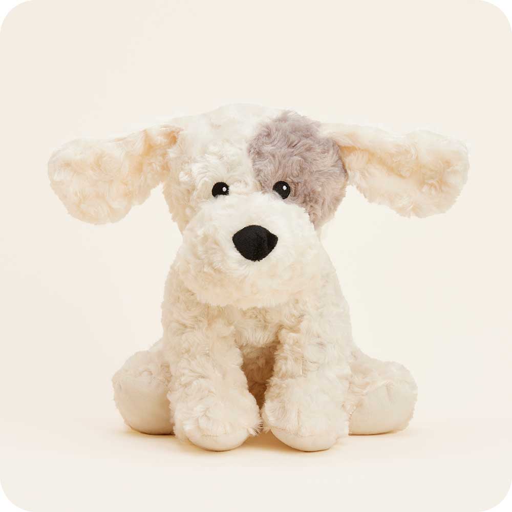 Warmies plush stuffed dog toy with cream fur and gray eye patch