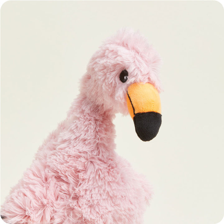 Pink flamingo Warmies plush toy with fluffy fur and orange-black beak