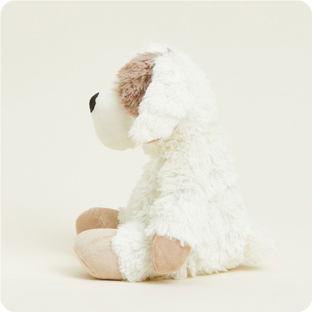 Warmies cream colored plush puppy stuffed animal with brown ears sitting against white background