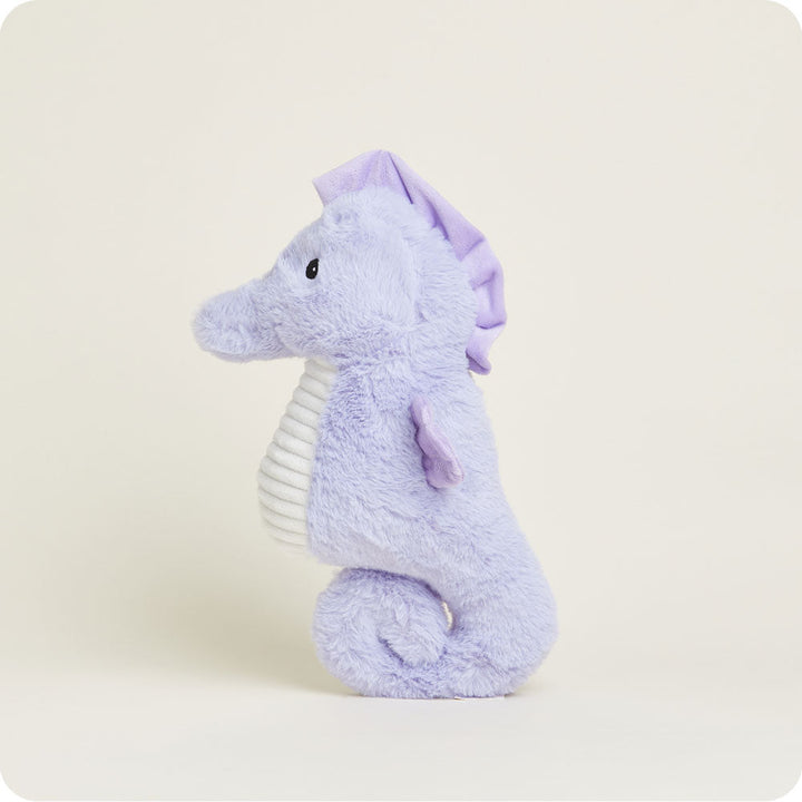 Purple plush seahorse stuffed animal with curved tail and white belly stripe