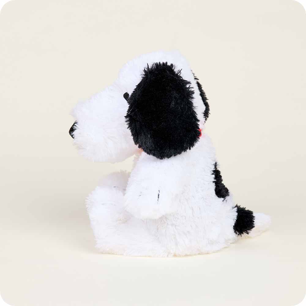 Warmies Snoopy plush toy with white fluffy body and black ears and spots