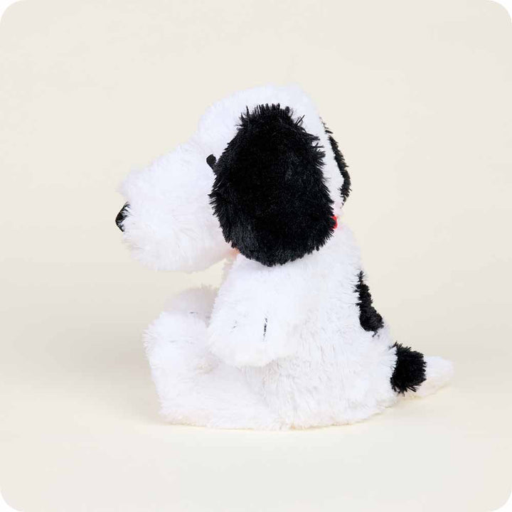 Warmies Snoopy plush toy with white fluffy body and black ears and spots