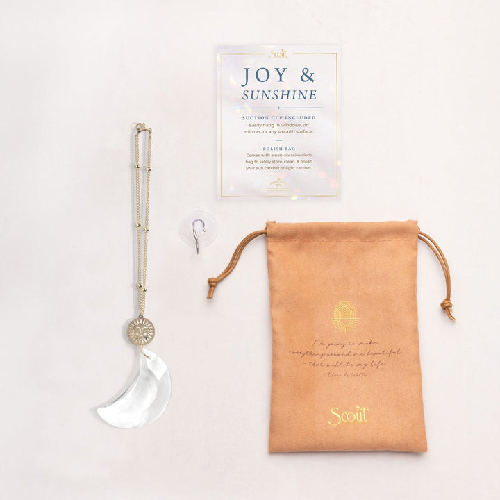 Scout crystal moon suncatcher with gold sun charm, suction cup, and storage bag