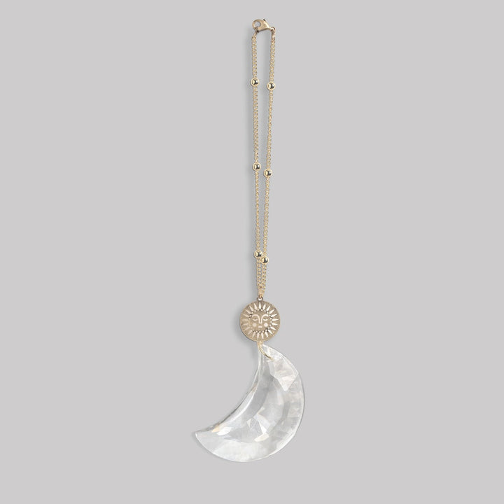 Scout Pocket Suncatcher necklace with gold sun charm and clear crescent moon pendant