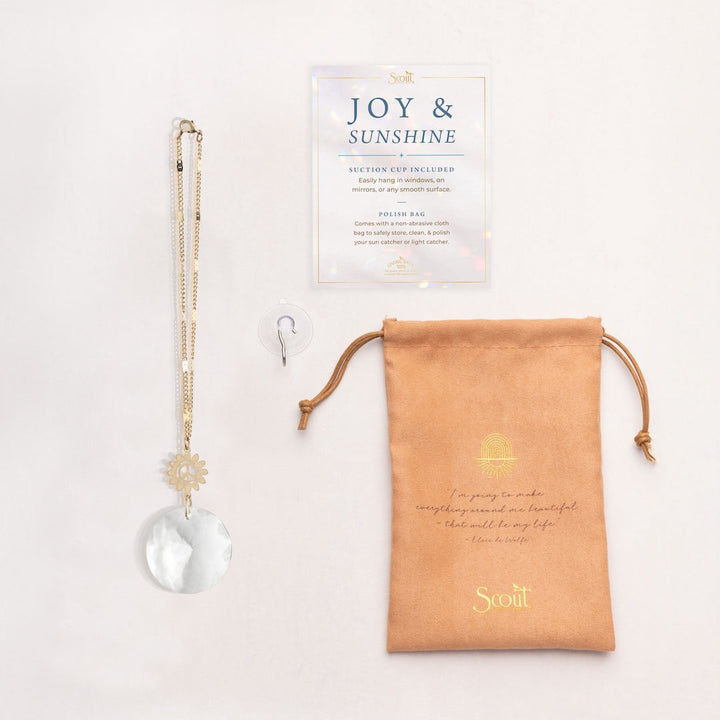 Scout Pocket Suncatcher with clear crystal prism and gold sun charm in packaging