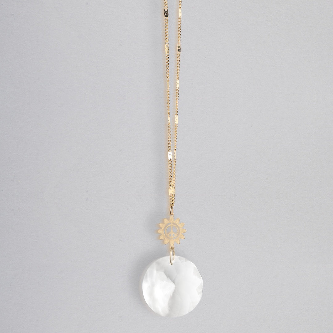 Scout Pocket Suncatcher necklace with gold chain, sun charm, and white crystal pendant