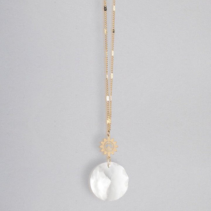 Scout Pocket Suncatcher necklace with gold chain, sun charm, and white crystal pendant