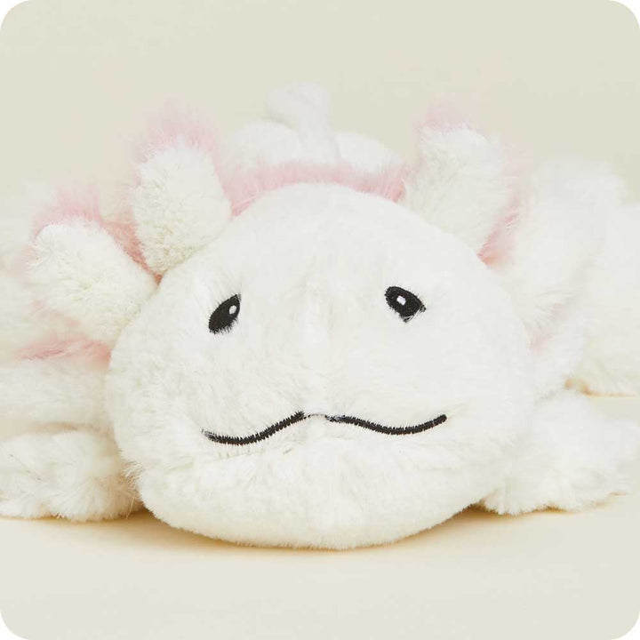 White plush axolotl stuffed animal with pink accents, black embroidered eyes and wavy mouth