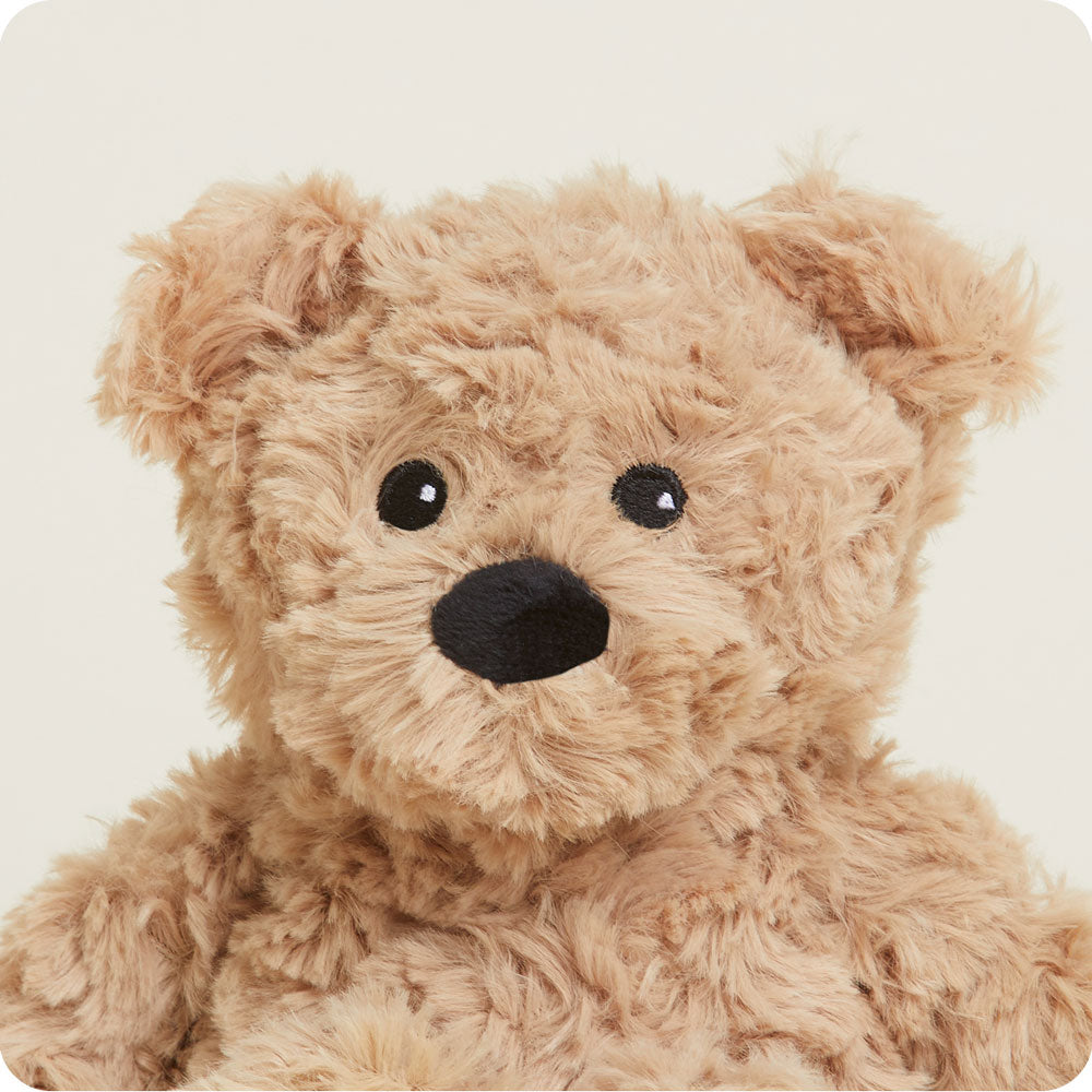 Brown curly textured Warmies teddy bear with black nose and eyes on white background