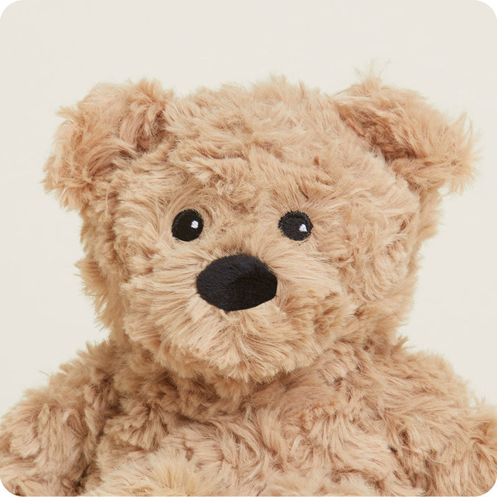 Brown curly textured Warmies teddy bear with black nose and eyes on white background