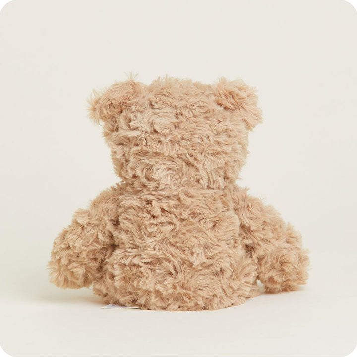 Warmies Junior brown curly textured plush teddy bear on white background