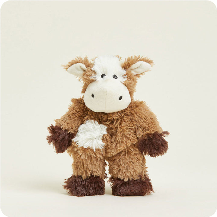 Warmies Junior brown and white cow plush toy with fluffy fur