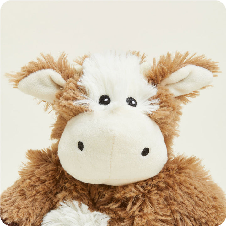 Warmies Junior brown and white cow plush stuffed animal with fluffy fur