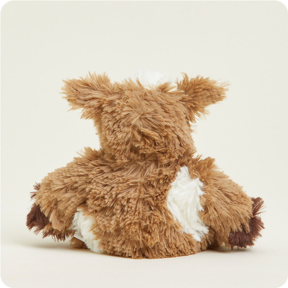 Brown and white cow-patterned Junior Warmies plush toy viewed from behind on white background