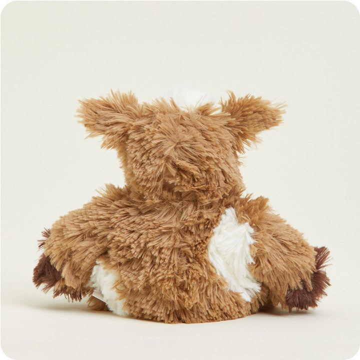 Brown and white cow-patterned Junior Warmies plush toy viewed from behind on white background