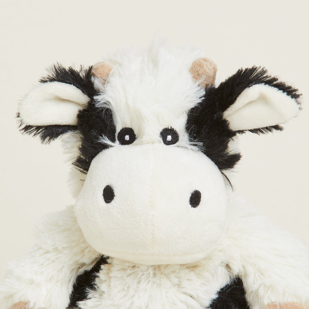 Warmies Junior plush cow stuffed animal in black and white cow pattern