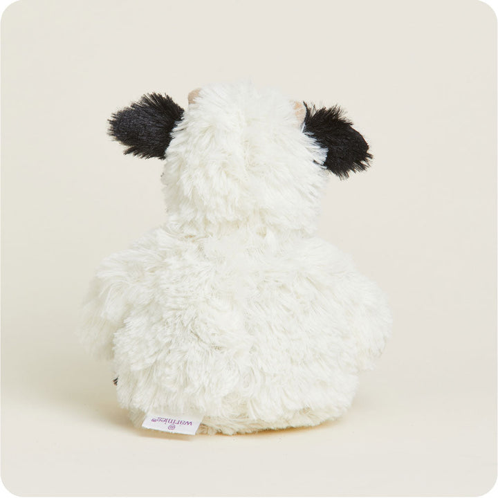Warmies Junior plush cow stuffed animal in black and white cow pattern