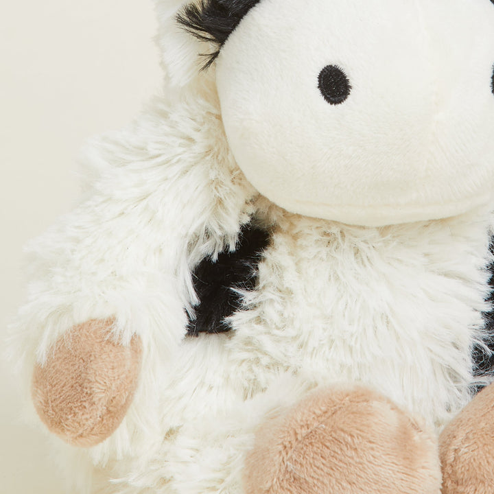 Warmies Junior plush cow stuffed animal with black and white spotted pattern