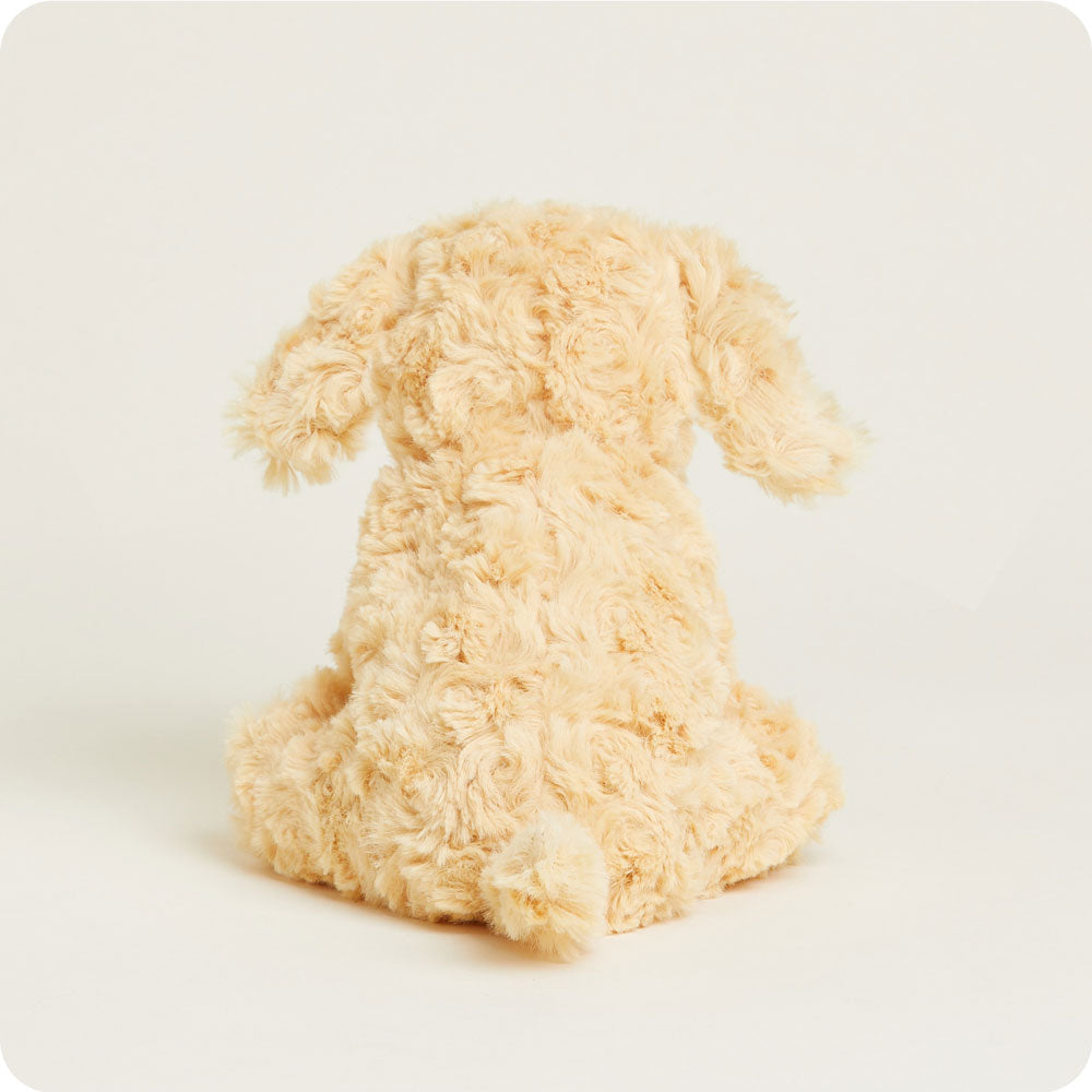 Golden cream colored plush dog stuffed animal sitting on white background