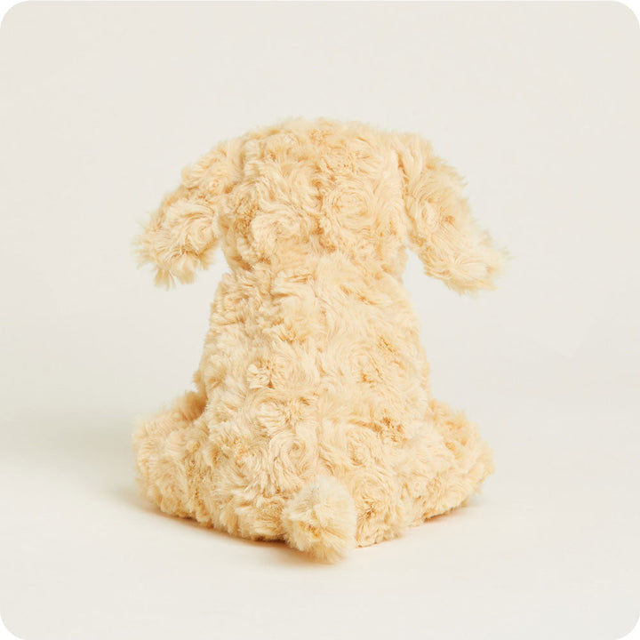 Golden cream colored plush dog stuffed animal sitting on white background
