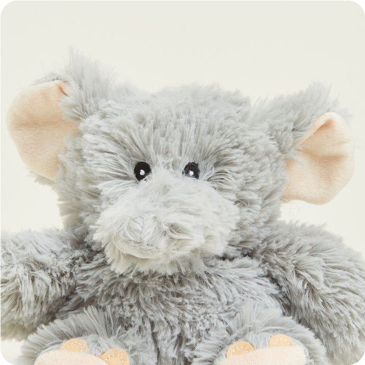 Gray plush elephant stuffed animal with pink ears and paws on white background