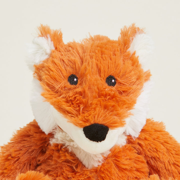 Orange and white fox plush toy with black embroidered eyes and nose