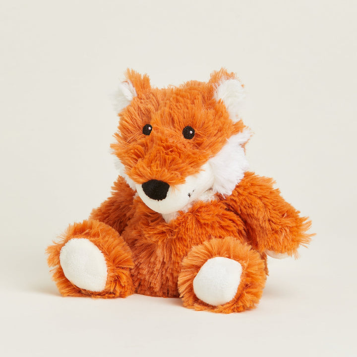 Warmies Junior orange fox plush toy with white accents sitting against neutral background