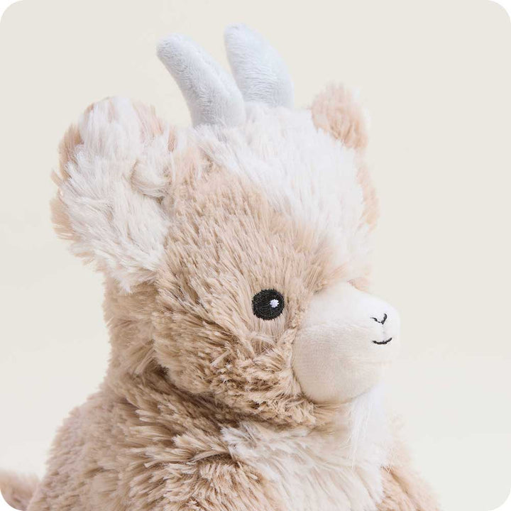 Warmies Junior plush goat stuffed animal in light brown and white with blue ears
