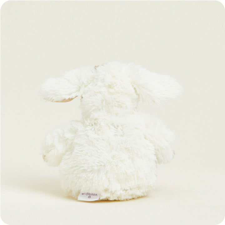 Warmies Junior plush puppy stuffed animal in cream white color with fuzzy fur texture