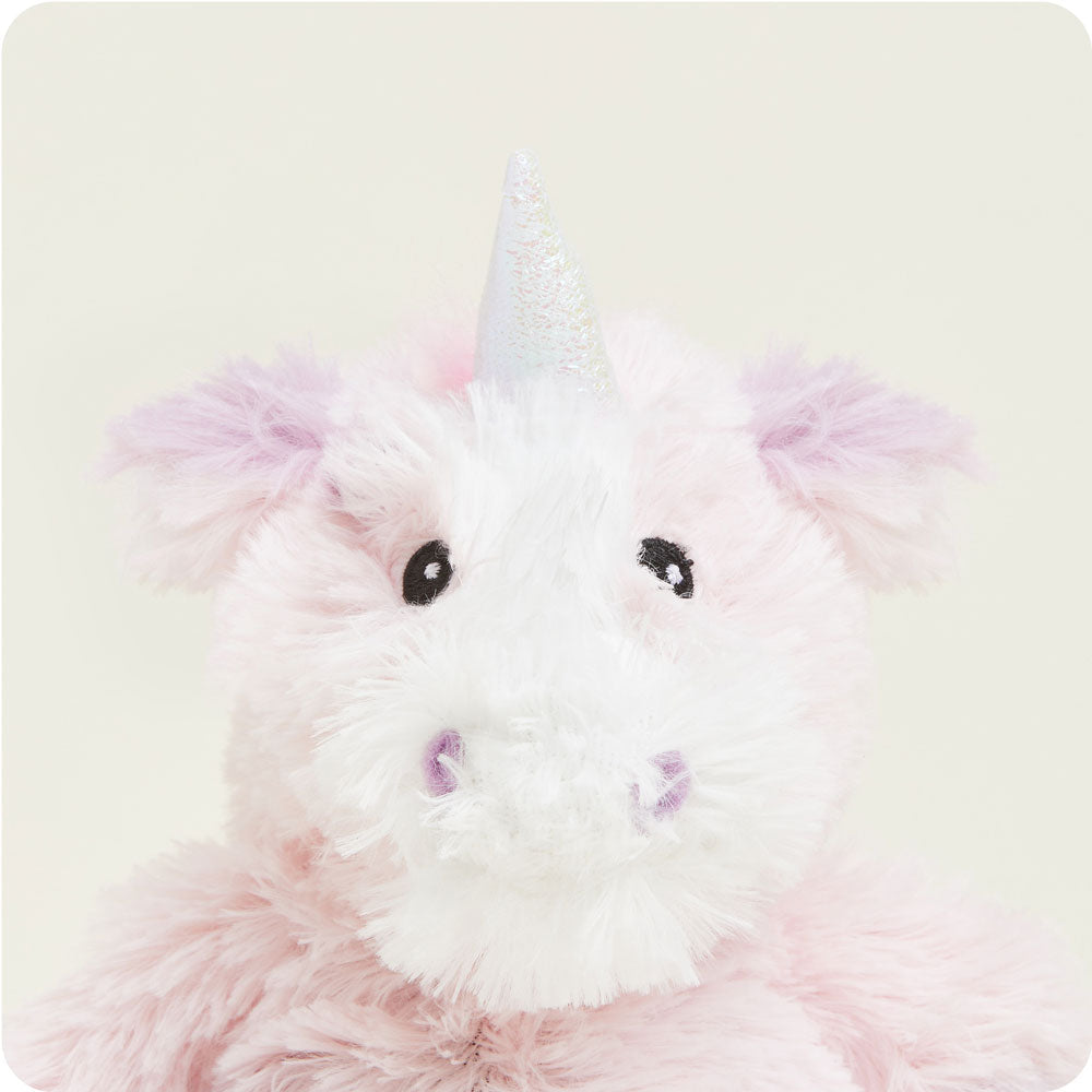 Pink and white plush unicorn stuffed animal with sparkly horn and black eyes