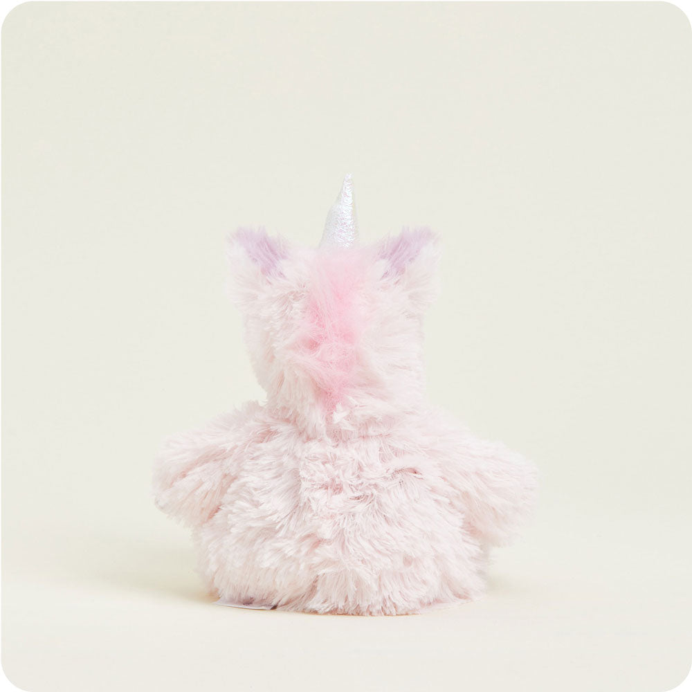 Pink fluffy unicorn Warmies plush toy with iridescent horn on white background