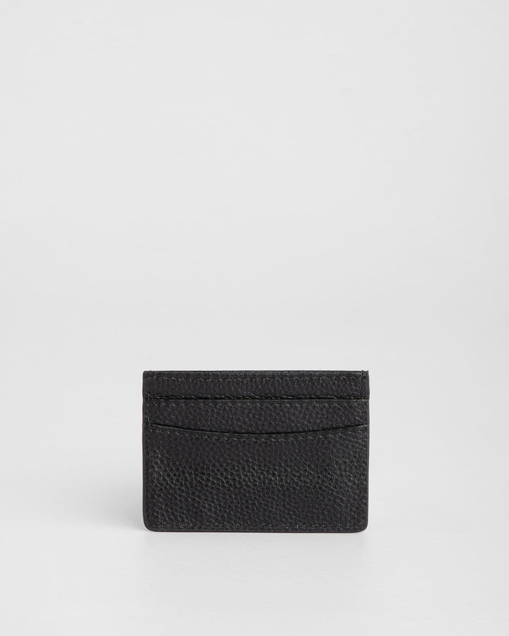 Black leather card holder with textured finish and multiple card slots