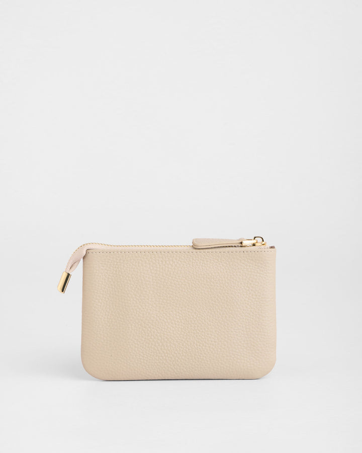 Stone beige leather coin purse with gold zipper and pull tab on white background
