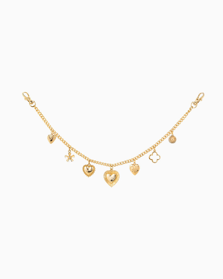 Gold chain bag charm featuring heart, clover, flower, and coin pendants with lobster clasps.
