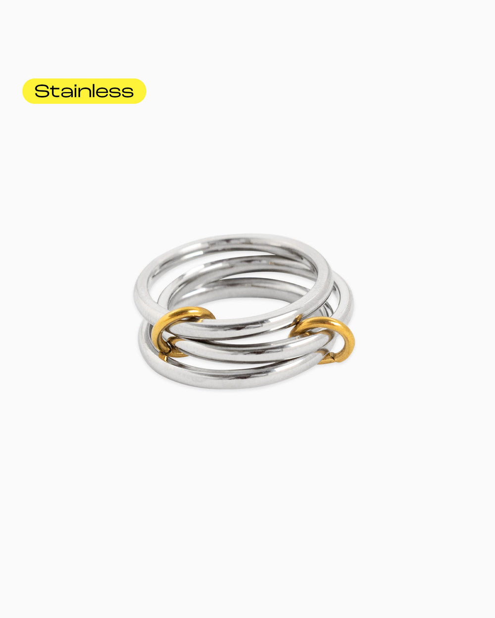 Sessori stainless steel interlocking ring stack with gold connector rings on white background.