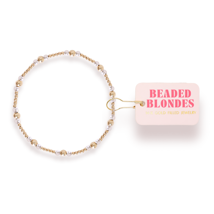 Beaded Blondes Dainty Sutton stretch bracelet with alternating gold and silver beads.