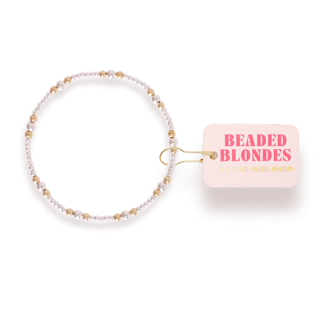 Beaded Blondes Dainty Sutton Bracelet featuring alternating silver and gold beads with brand tag