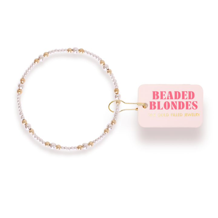 Beaded Blondes Dainty Sutton Bracelet featuring alternating silver and gold beads with brand tag