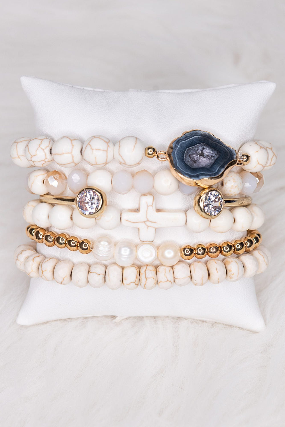 Dylan Jewelry Aspen white beaded bracelet set with gold accents, cross, geode, and crystal charms