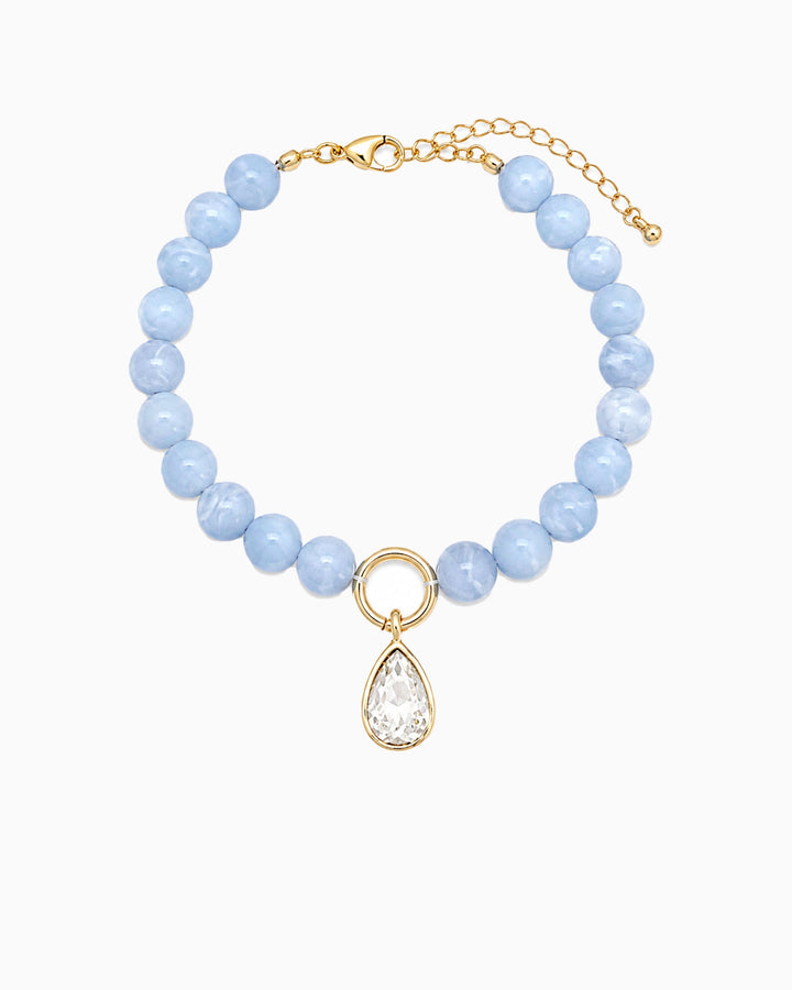 Sessori light blue marble bead bracelet with gold ring and clear crystal teardrop charm pendant