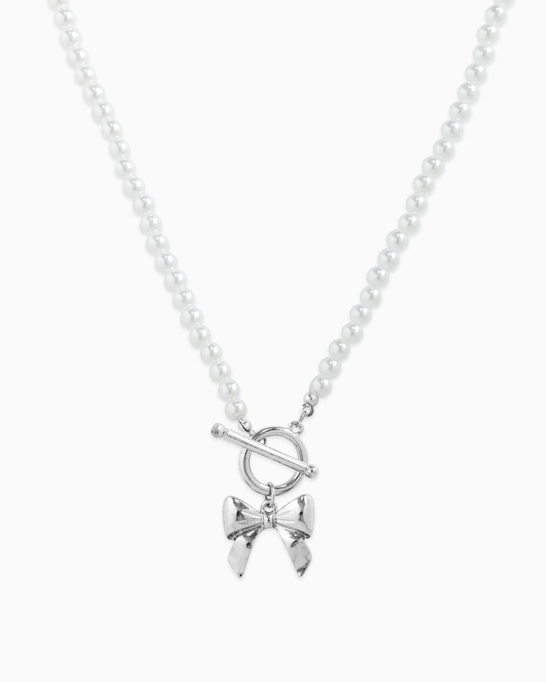 Sessori pearl beaded necklace with silver rhodium toggle clasp and bow pendant charm