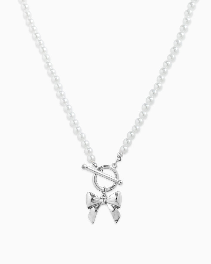Sessori pearl beaded necklace with silver rhodium toggle clasp and bow pendant charm