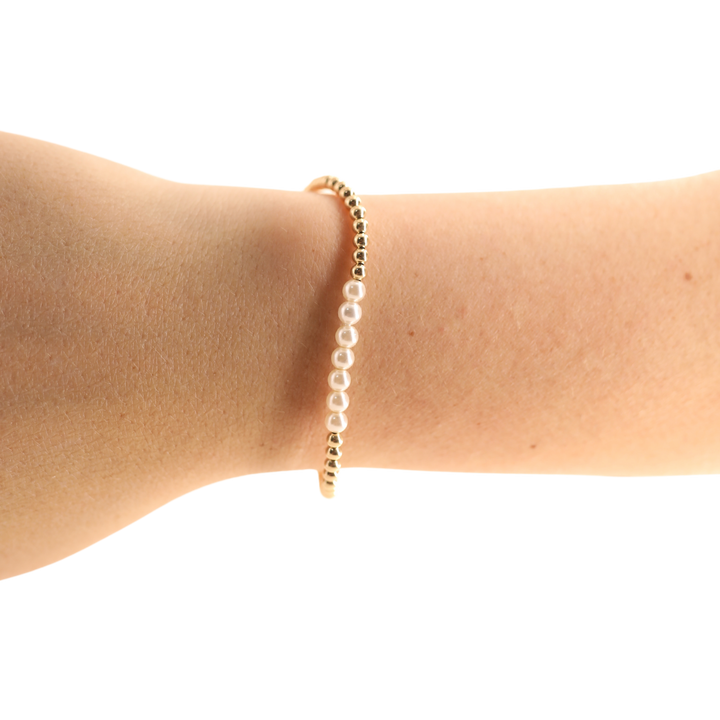 Beaded Blondes Sophia Pearl Bracelet in gold with white pearl accents worn on wrist